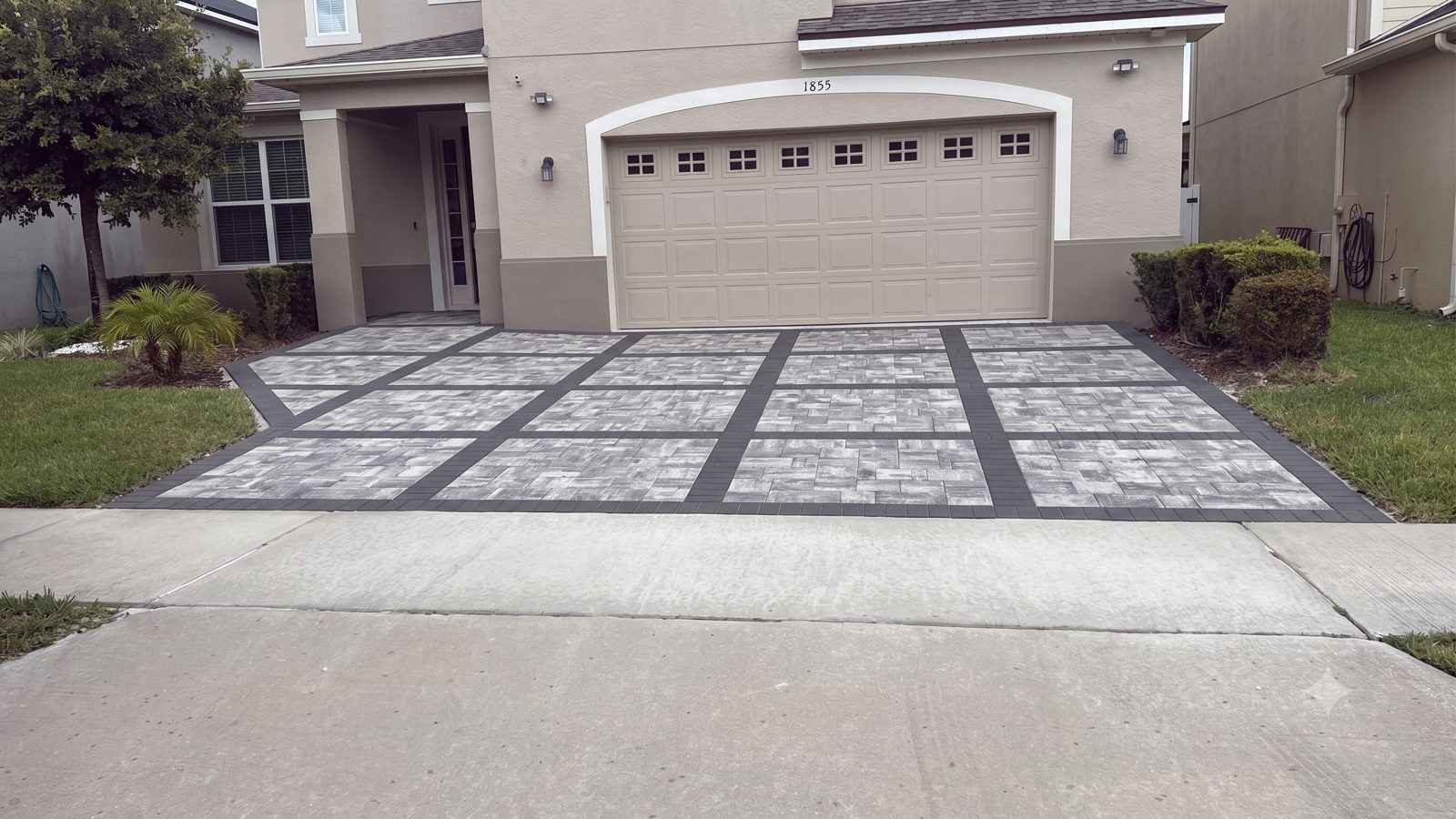 Paver driveway with charcoal border by Lakewood Ranch Concrete in Lakewood Ranch, Manatee & Sarasota