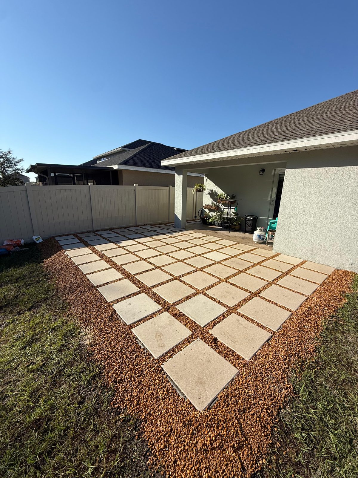 Spaced paver patio with gravel joints by Lakewood Ranch Concrete in Lakewood Ranch, Manatee & Sarasota